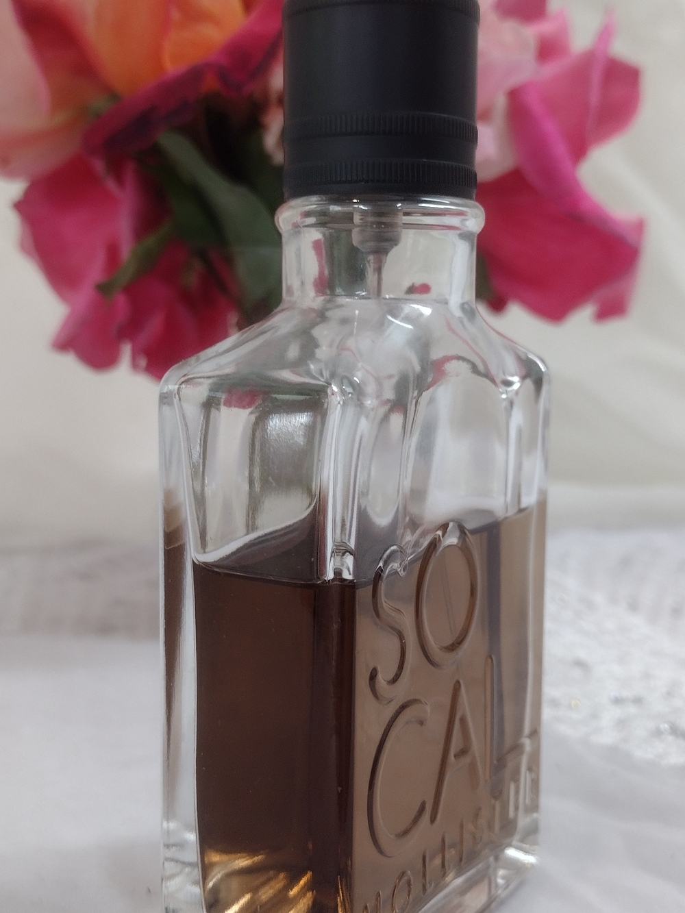 Eau de Cologne Bottle with Amber Liquid and Black Cap